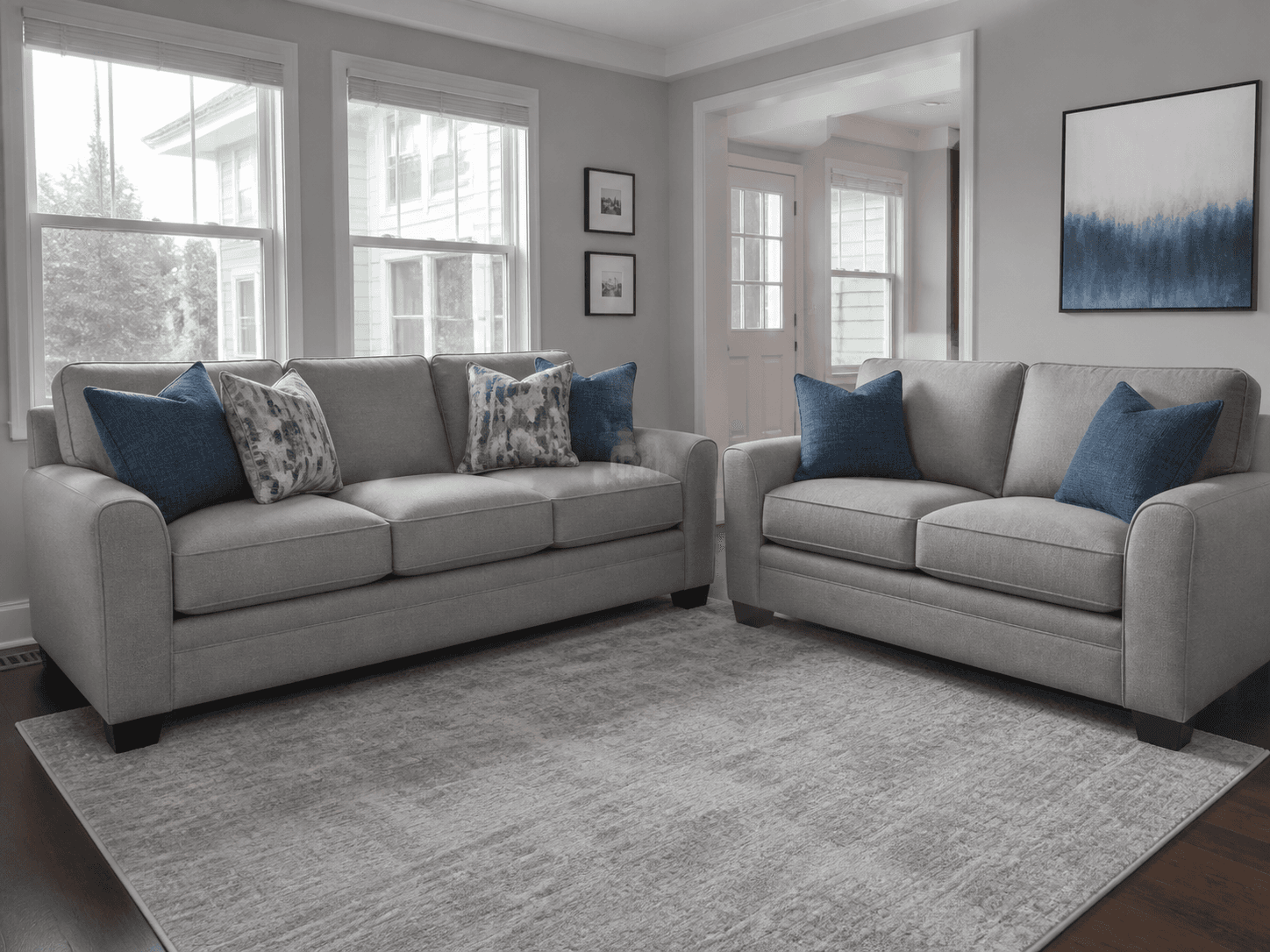 Clean coordinated sofa and loveseat in a family room