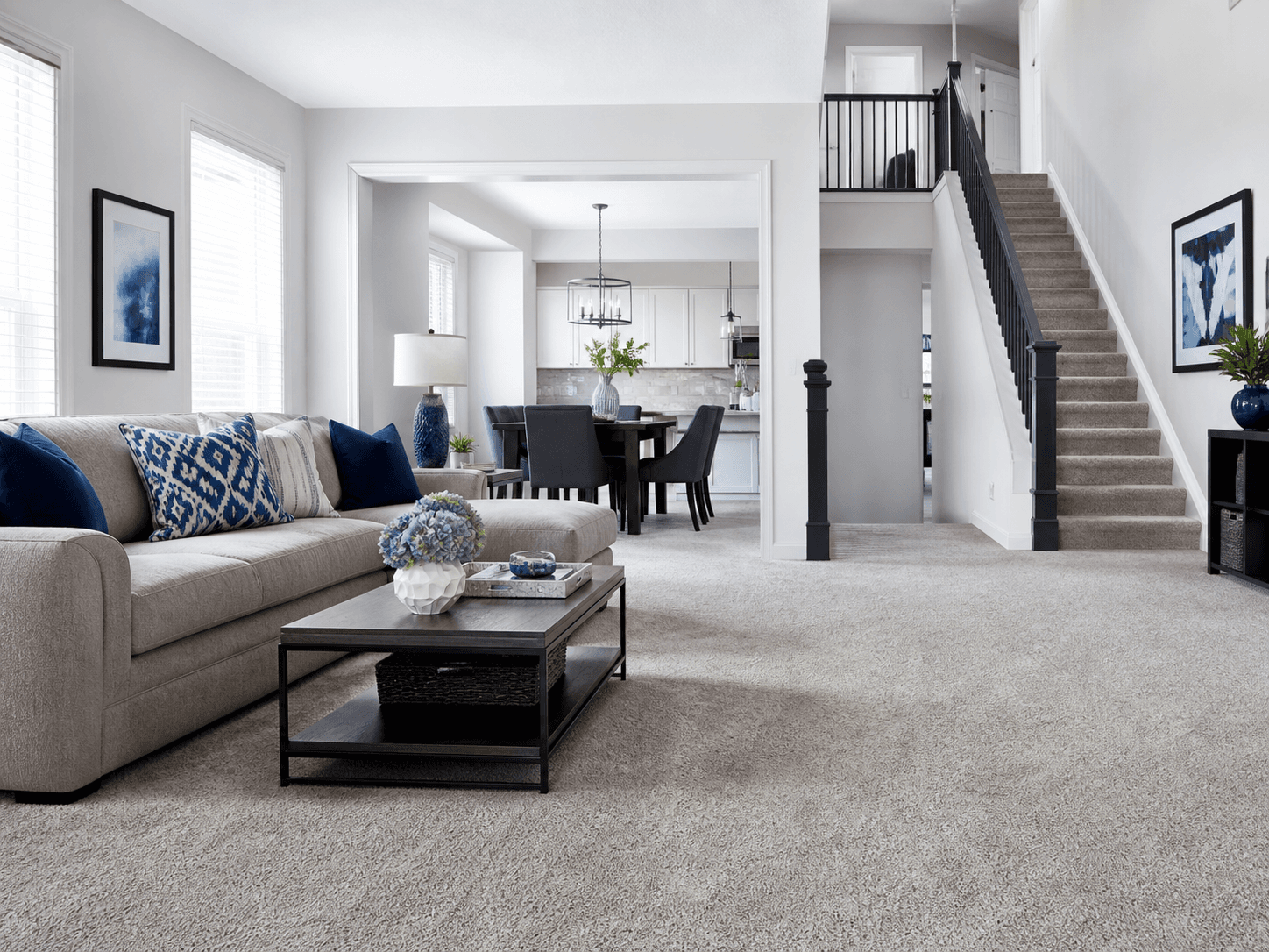 Fresh carpet throughout a living room, hallway, and staircase
